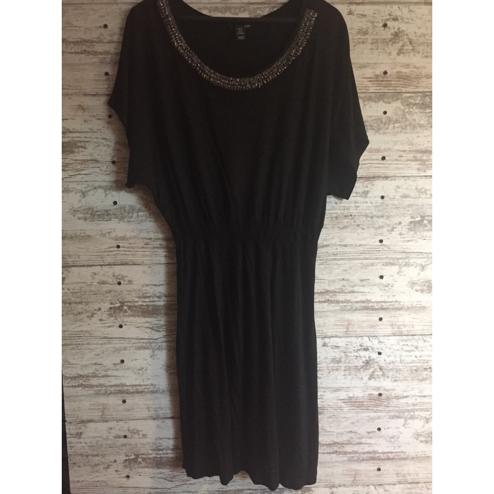 Black short sleeve dress with beaded neckline
